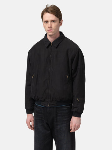 Half body shot of  the Model wearing the A.PRESSE Vintage Cotton Silk Moleskin Jacket in Black zipped up