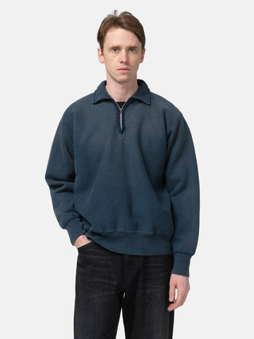 Half body shot of the Model standing in studio wearing the A.PRESSE Vintage Half Zip Sweatshirt in Blue