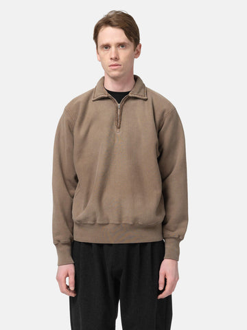 Half body shot of the Model standing in studio wearing the A.PRESSE Vintage Half Zip Sweatshirt in Brown