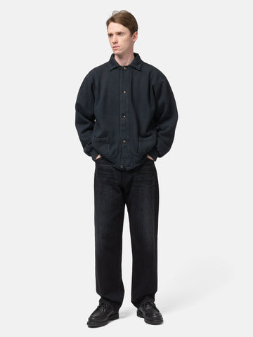 Model standing in studio wearing the A.PRESSE Vintage Sweat Cardigan in Black