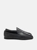 Side view of the AURALEE Soft Leather Loafers in Black