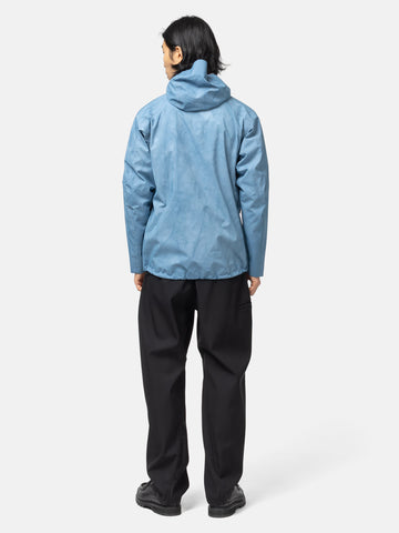 back shot of the Model wearing the Spectre Jacket in GORE-TEX 3L Nylon Hand Dyed Indigo