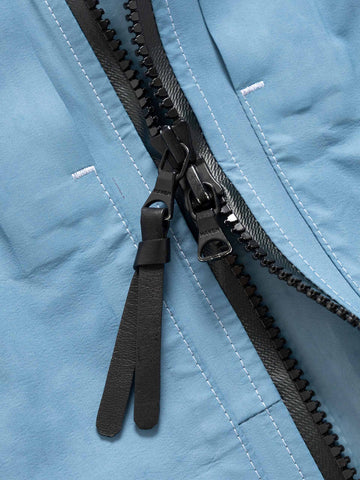 Details of the zipper on the Spectre Jacket in GORE-TEX 3L Nylon Hand Dyed Indigo