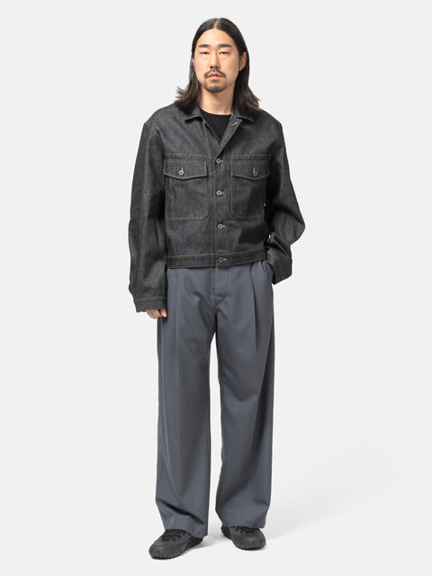 full-body view of the model wearing LEMAIRE Pleated Tailored Pants Carbon
