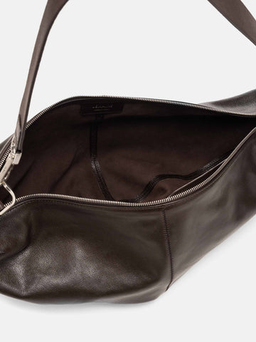 Close up of the inside of the LEMAIRE Quiver Clip Bag Dark Chocolate