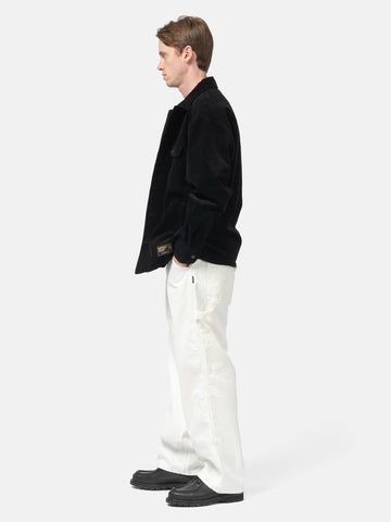 side view of model wearing NEIGHBORHOOD Denim Painter Pants White