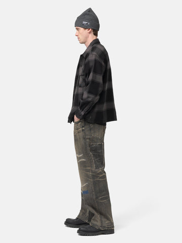 side view of model wearing NEIGHBORHOOD Savage Denim DP Wide Pants Black