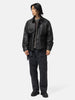 Full body shot of the model wearing the Neighborhood Coated Field Jacket Black