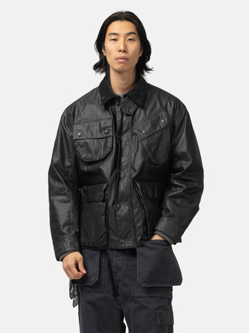 Half body shot of the model wearing the Neighborhood Coated Field Jacket Black