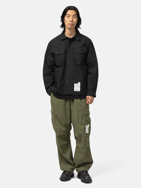 Full body shot of the model wearing the Neighborhood Fatigue Shirt LS Black