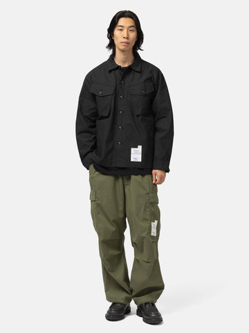 Full body shot of the model wearing the Neighborhood Fatigue Shirt LS Black