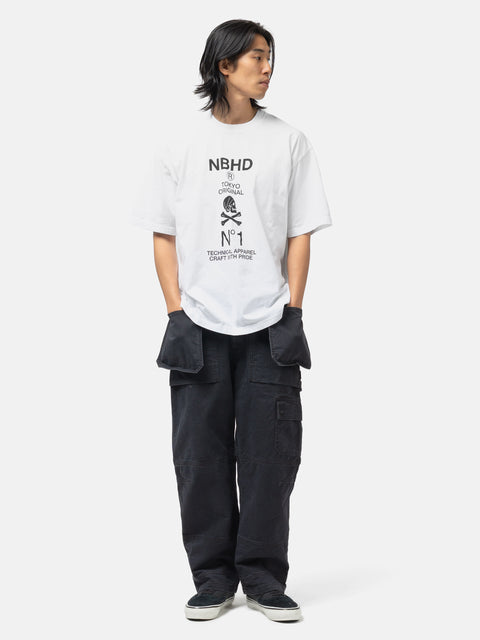 Full body shot of the model wearing the Neighborhood NH . Tee SS-8 White