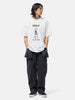 Full body shot of the model wearing the Neighborhood NH . Tee SS-8 White