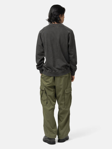 Back of the model wearing the Neighborhood Pigment Dyed Sweat Shirt LS Black