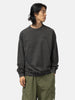 Half body shot of the model wearing the Neighborhood Pigment Dyed Sweat Shirt LS Black