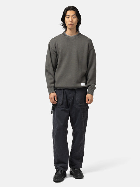 Full body shot of the model wearing the Neighborhood Savage Crewneck Sweater Charcoal