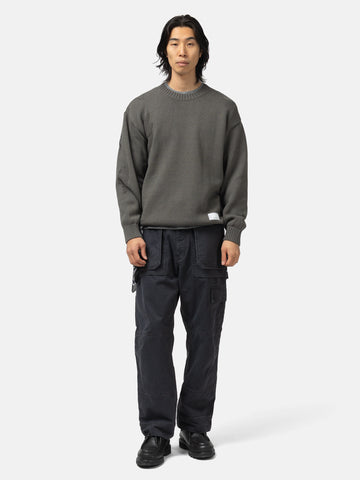 Full body shot of the model wearing the Neighborhood Savage Crewneck Sweater Charcoal