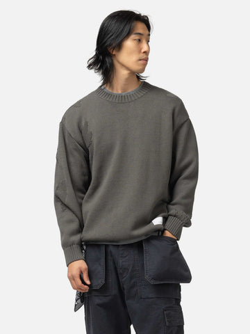 Half body shot of the model wearing the Neighborhood Savage Crewneck Sweater Charcoal