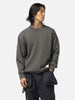 Half body shot of the model wearing the Neighborhood Savage Crewneck Sweater Charcoal