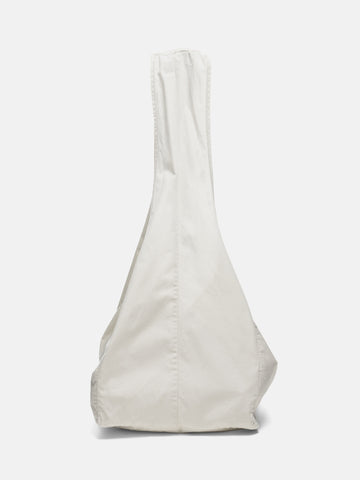 Side shot of the Neighborhood Solid Newspaper Bag Ivory