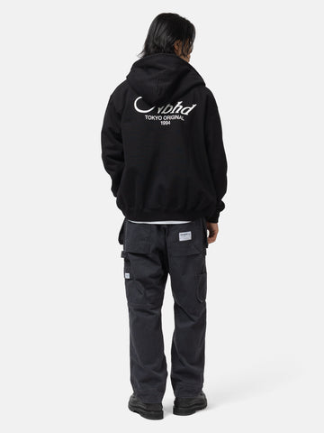 Back shot of the model wearing the Neighborhood Staple Sweat Zip Hoodie LS Black