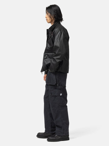 Side shot of the model wearing the Neighborhood Tool Pocket Utility Pants Black