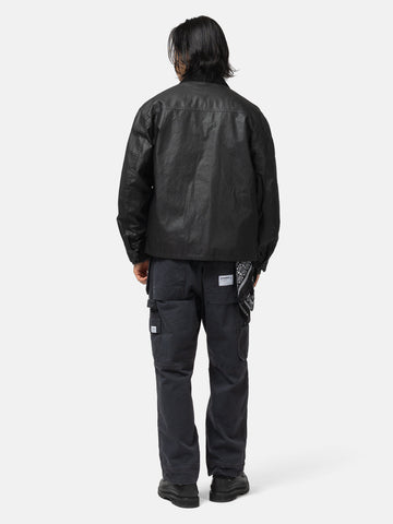 Back shot of the model wearing the Neighborhood Tool Pocket Utility Pants Black