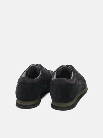 Rear view of the Reproduction of Found British Military Trainer in Black premium suede and nylon photographed in studio.