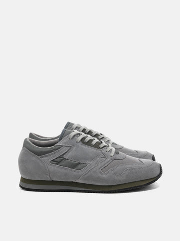 Side view of the Reproduction of Found British Military Trainer in Grey premium suede and nylon photographed in studio.