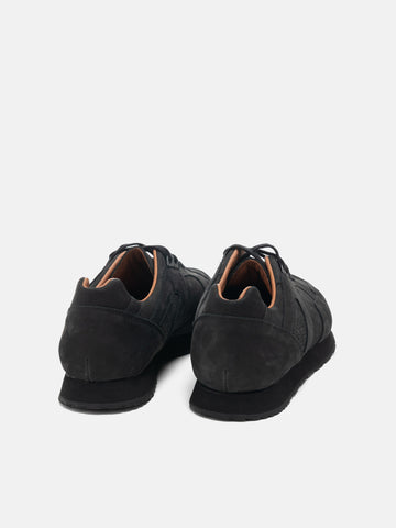 Rear view of the Reproduction of Found French Military Trainer in black nubuck leather photographed in studio.