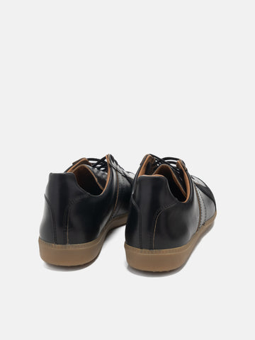 Rear view of the Reproduction of Found German Military Trainer in black Horween Chromexcel leather photographed in studio.