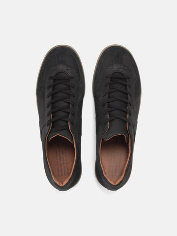 Top view of the Reproduction of Found German Military Trainer in black Italian suede and Nappa leather photographed in studio.
