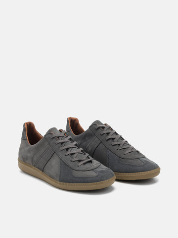 Three quarter view of the Reproduction of Found German Military Trainer in dark grey Italian suede and Nappa leather photographed in studio.