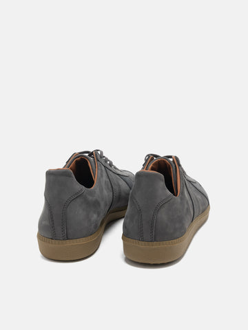 Rear view of the Reproduction of Found German Military Trainer in dark grey Italian suede and Nappa leather photographed in studio.