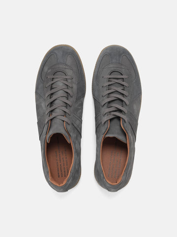 Top view of the Reproduction of Found German Military Trainer in dark grey Italian suede and Nappa leather photographed in studio.