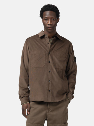 Half body shot of the model wearing the the Stone Island Cotton Micro-Corduroy Overshirt Umber