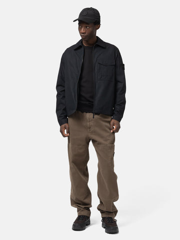 Full body shot of the model wearing the Stone Island Ghost Piece All-Weather Cotton Canvas Overshirt Black