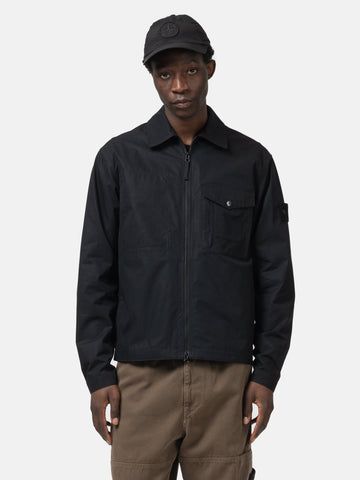 Half body shot of the model wearing the Stone Island Ghost Piece All-Weather Cotton Canvas Overshirt Black