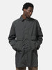 Half body shot of the model wearing the Stone Island Light Compact Touch Poly-TC Car Coat Charcoal Grey