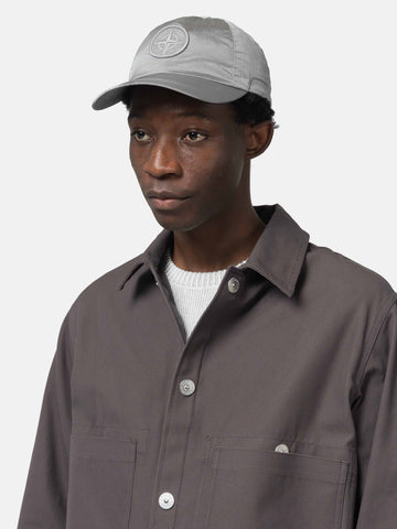 Close up of model wearing the Stone Island Nylon Metal Baseball Cap Pearl Grey