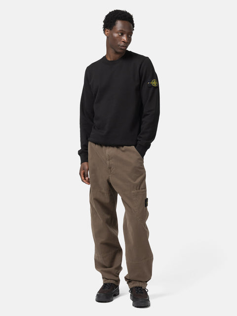 Full body shot of the model wearing the Stone Island Organic Cotton Fleece Crewneck Sweatshirt Black