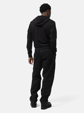 Back shot of the model wearing the the Stone island Organic Cotton Hooded Sweatshirt Black