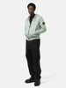 Full body shot of the model wearing the the Stone Island Organic Cotton Hooded Sweatshirt Sage