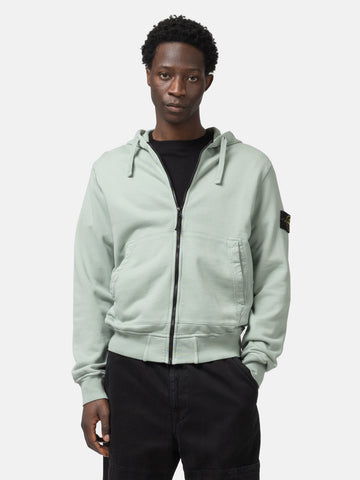 Half body shot of the model wearing the Stone Island Organic Cotton Hooded Sweatshirt Sage
