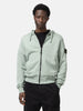 Half body shot of the model wearing the Stone Island Organic Cotton Hooded Sweatshirt Sage