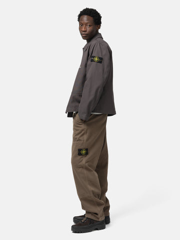 Side shot of the model wearing the Stone Island Organic Cotton Patch-Pocket Cargo Trouser Brown