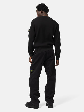 Back shot of the model wearing the Stone Island Organic Cotton Waffle Fleece Crewneck Black