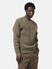 Half body shot of the model wearing the Stone Island Organic Cotton Waffle Fleece Crewneck Military Green