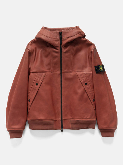 Flat shot of the Stone Island Textured Leather Hooded Jacket Brick Red