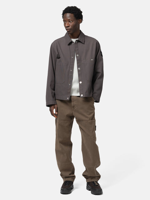 Full body shot of the model wearing the Stone island Cotton Canvas Coach Jacket Charcoal